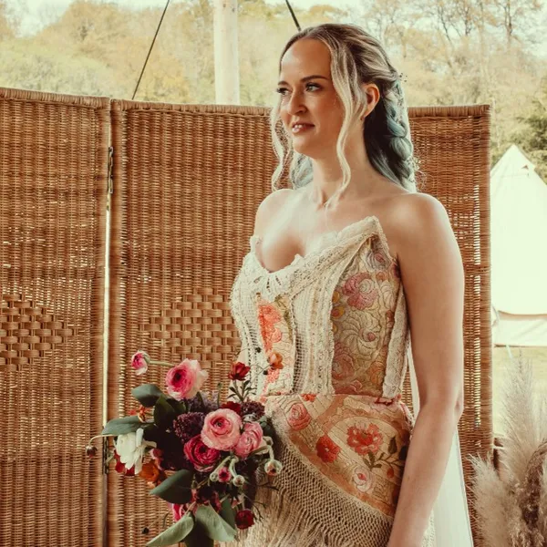 A bride holding her bouquet before the ceremony at Woodhill Weddings, Faversham, Kent
