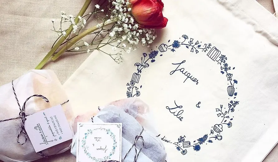 Jacques & Lilie tote bag, gift tags and wrapped parcels with a tulip and baby’s breath